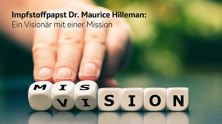 Hand bewegt Würfel, die die Worte Vision und Mission bilden.