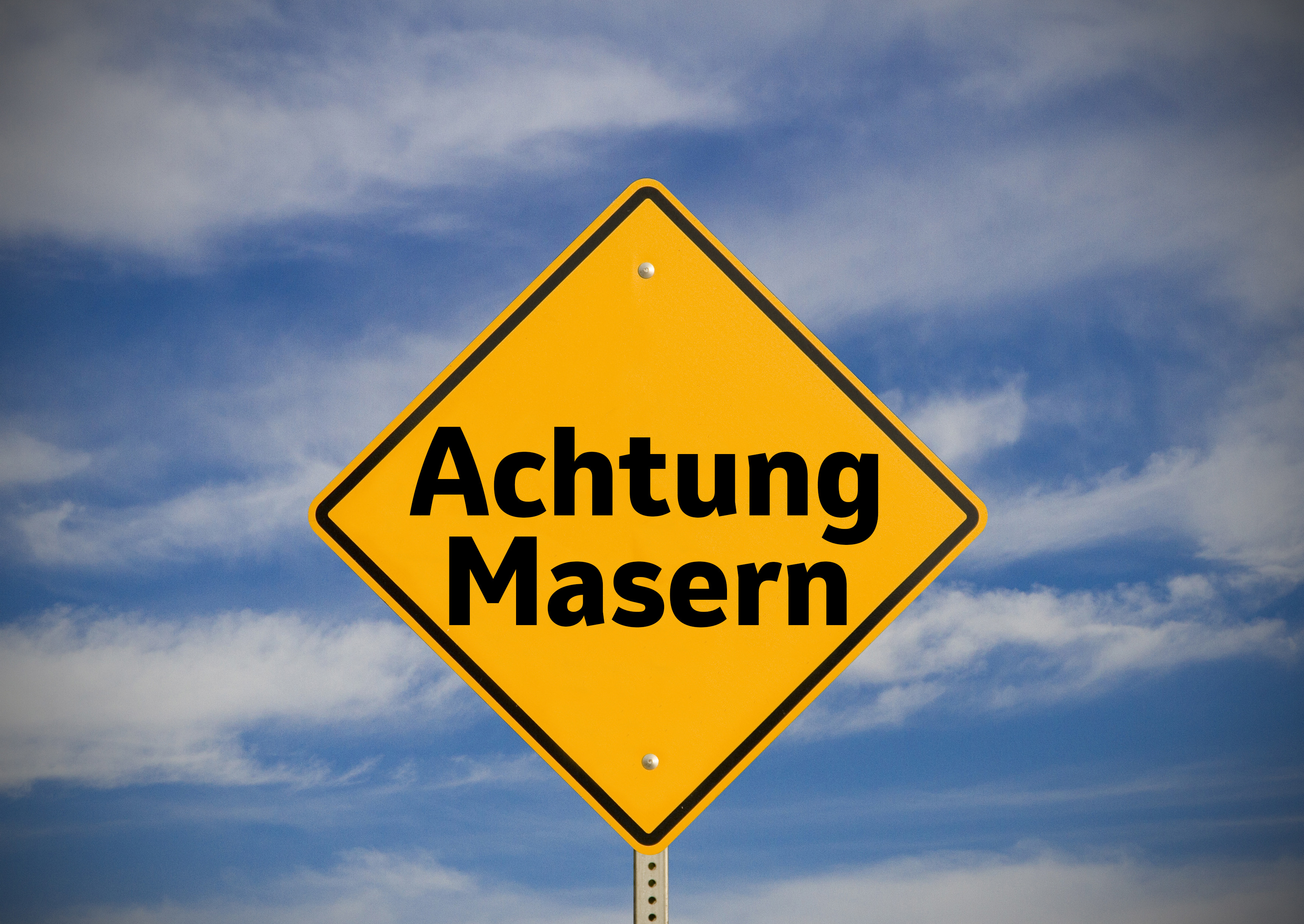  Ein Straßenschild mit der Aufschrift "Achtung Masern"